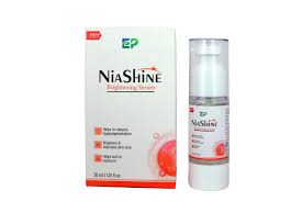 Conor Cosmo India Niashine Brightening Serum bottle with applicator and vibrant packaging, designed for skin glow and radiance.